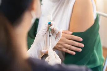Person receiving a vaccine injection