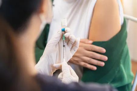 Person receiving a vaccine injection